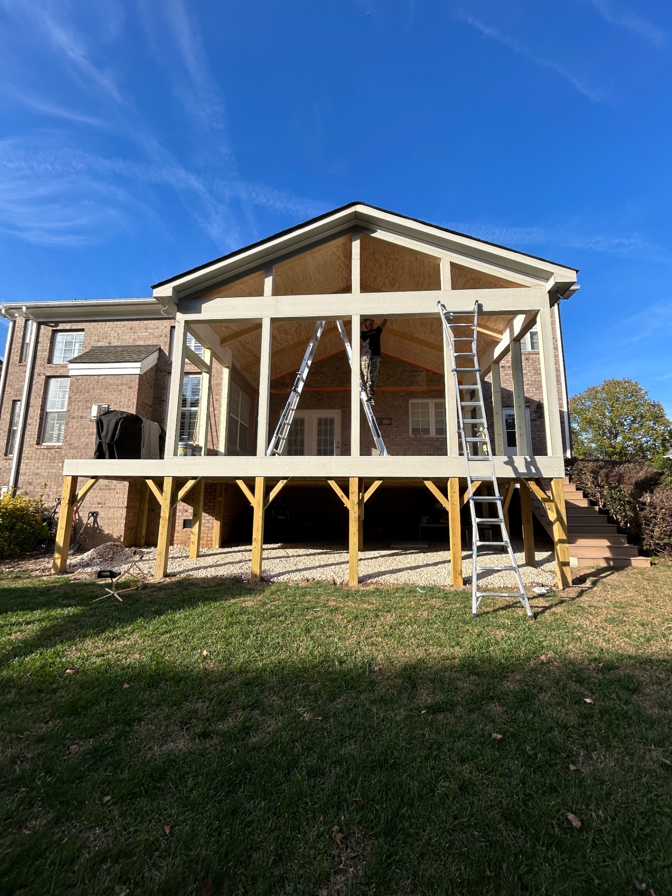 Framing complete — clear blue sky